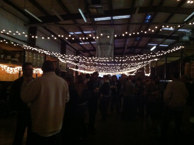 The inside of the event with some great lighting hanging from the ceiling.